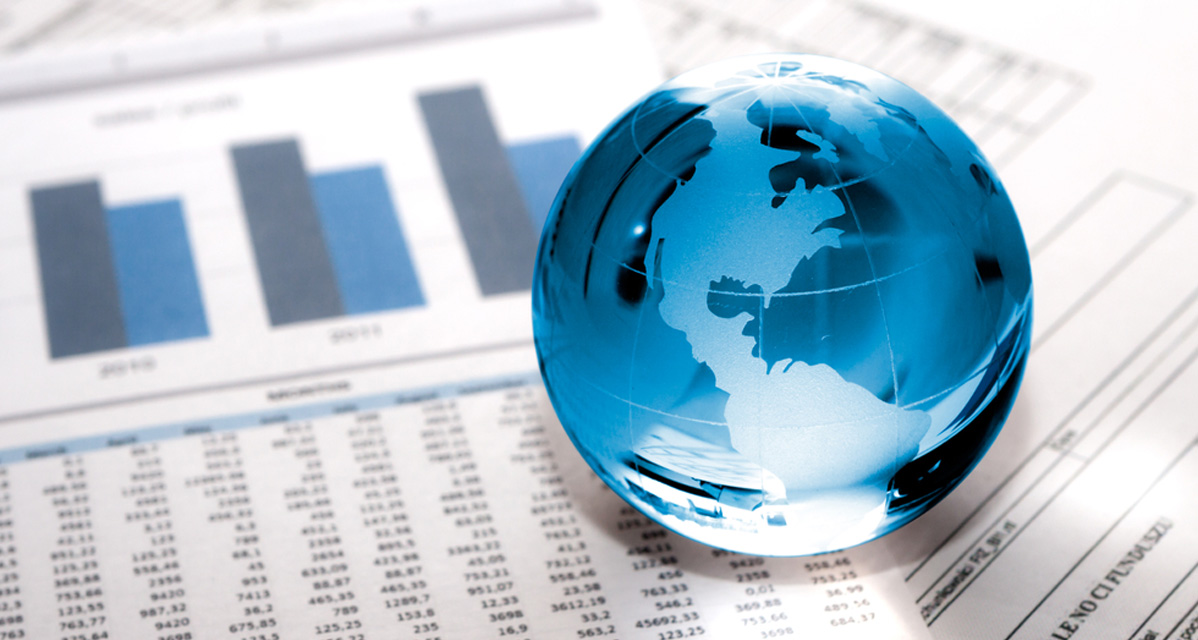 Glass globe on financial reports