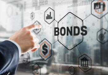Businessman pointing to sign with bonds